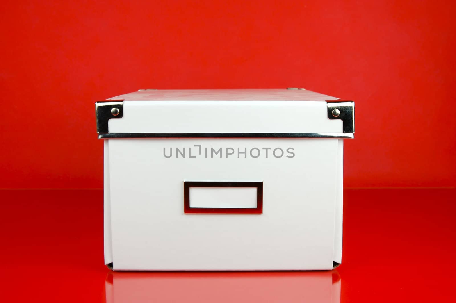 Storage boxes isolated against a red background