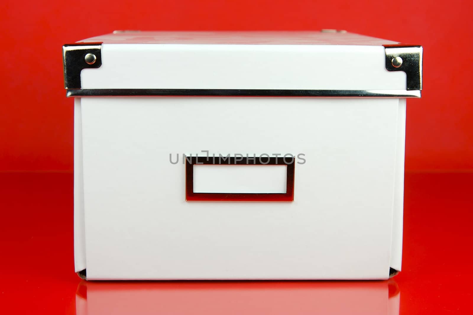 Storage boxes isolated against a red background