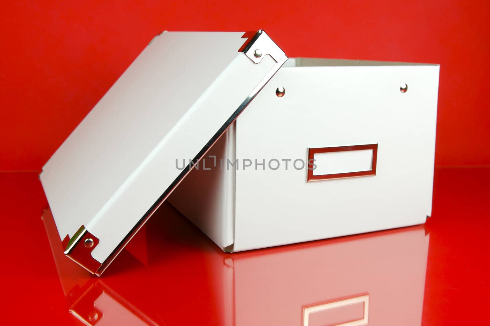 Storage boxes isolated against a red background