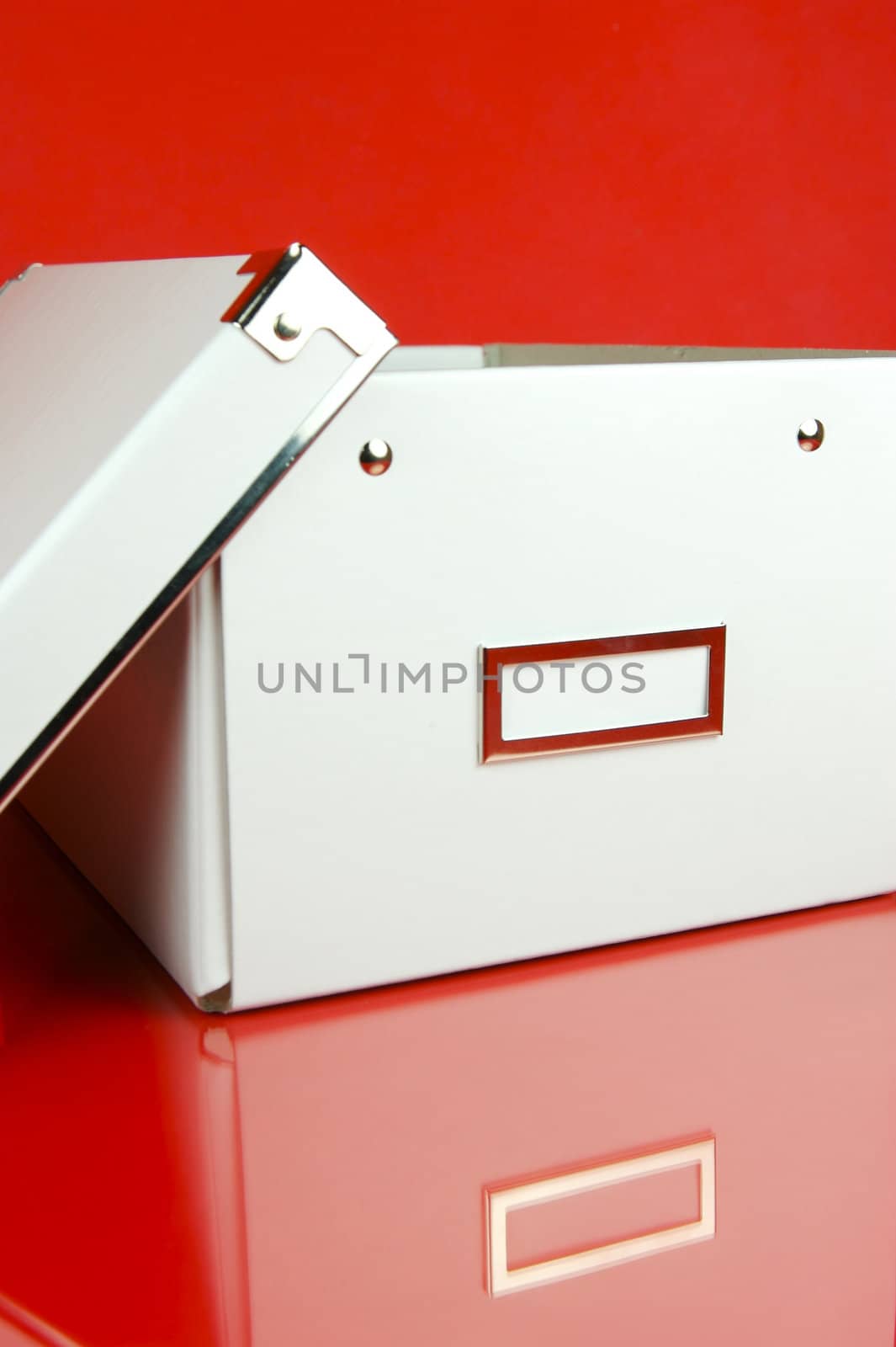 Storage boxes isolated against a red background