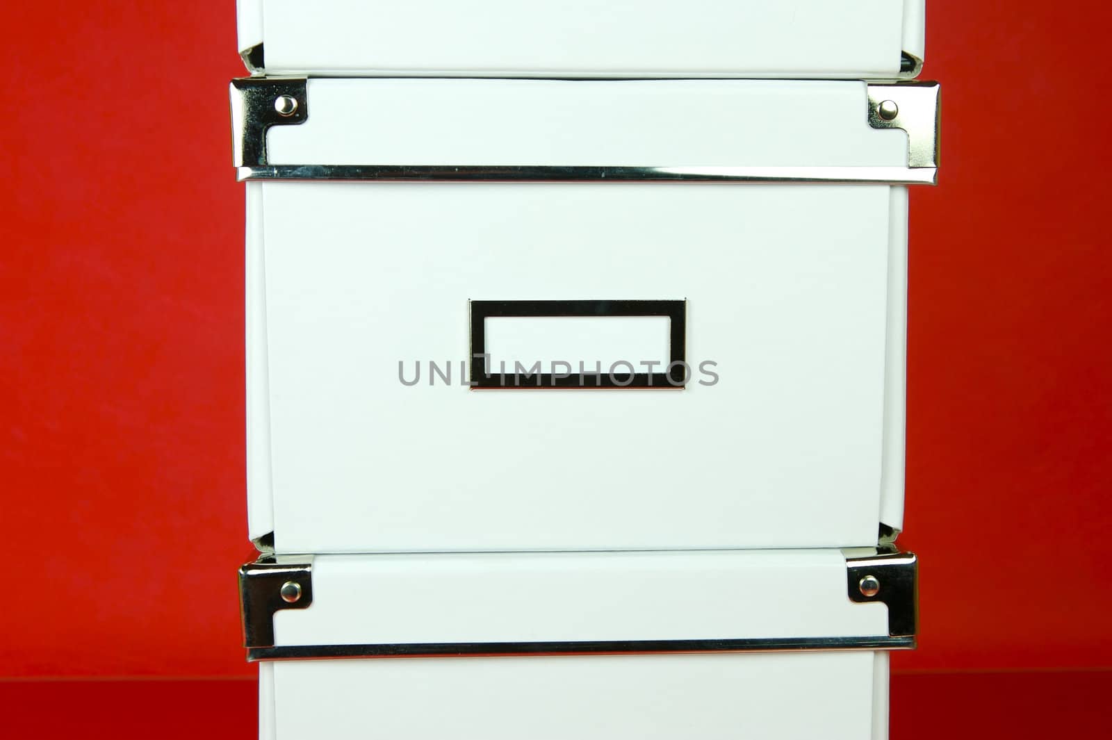 Storage boxes isolated against a red background