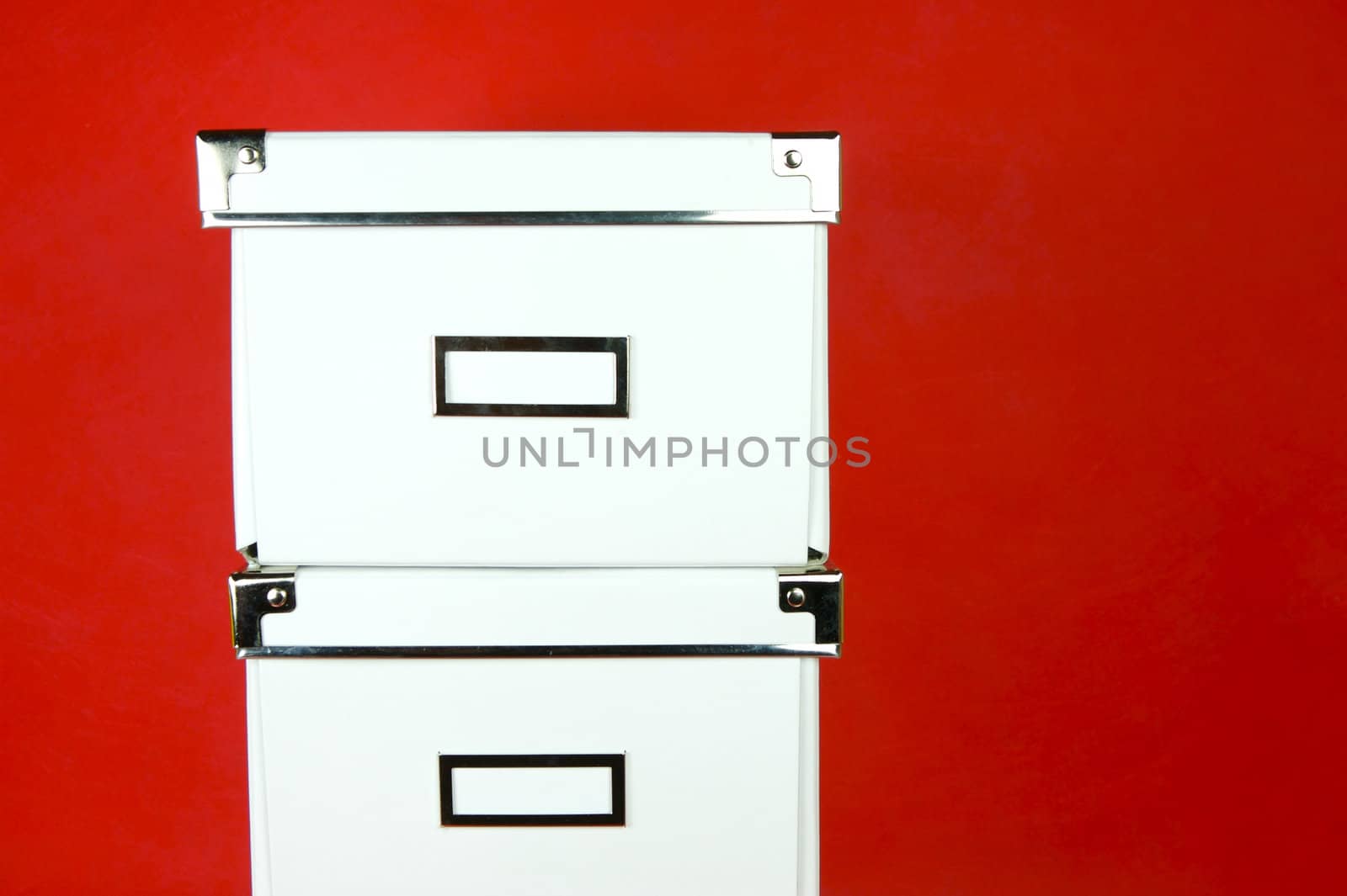 Storage boxes isolated against a red background