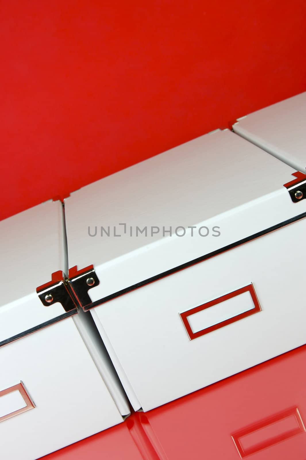 Storage boxes isolated against a red background