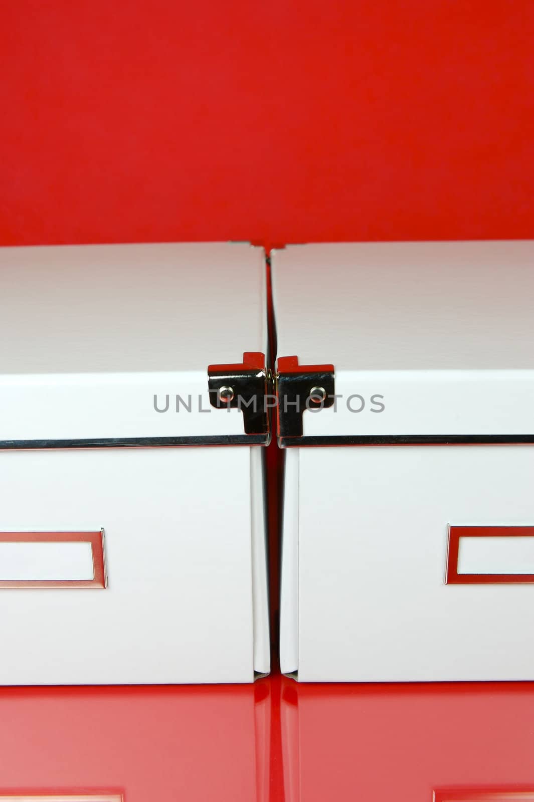 Storage boxes isolated against a red background