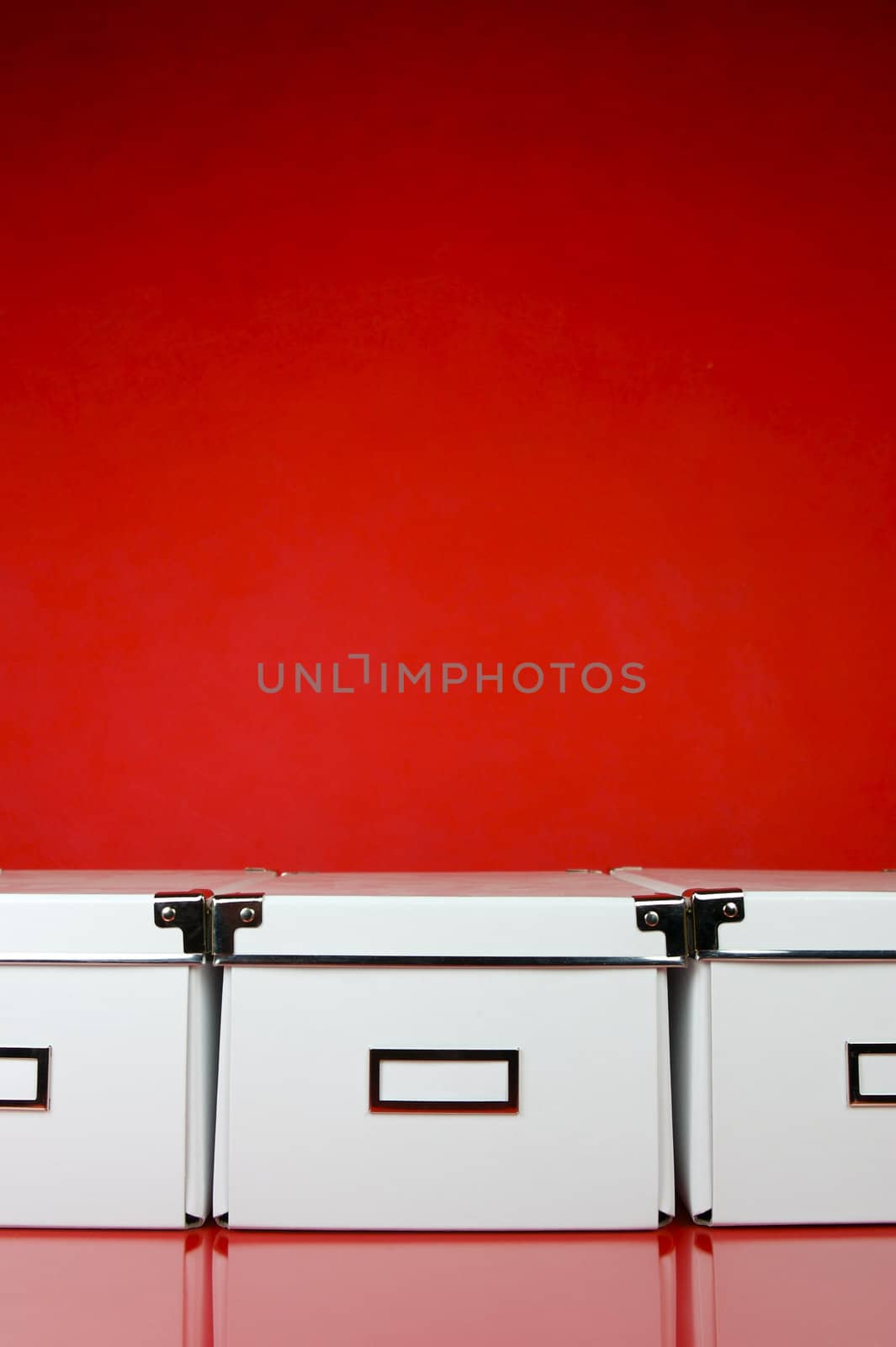 Storage boxes isolated against a red background