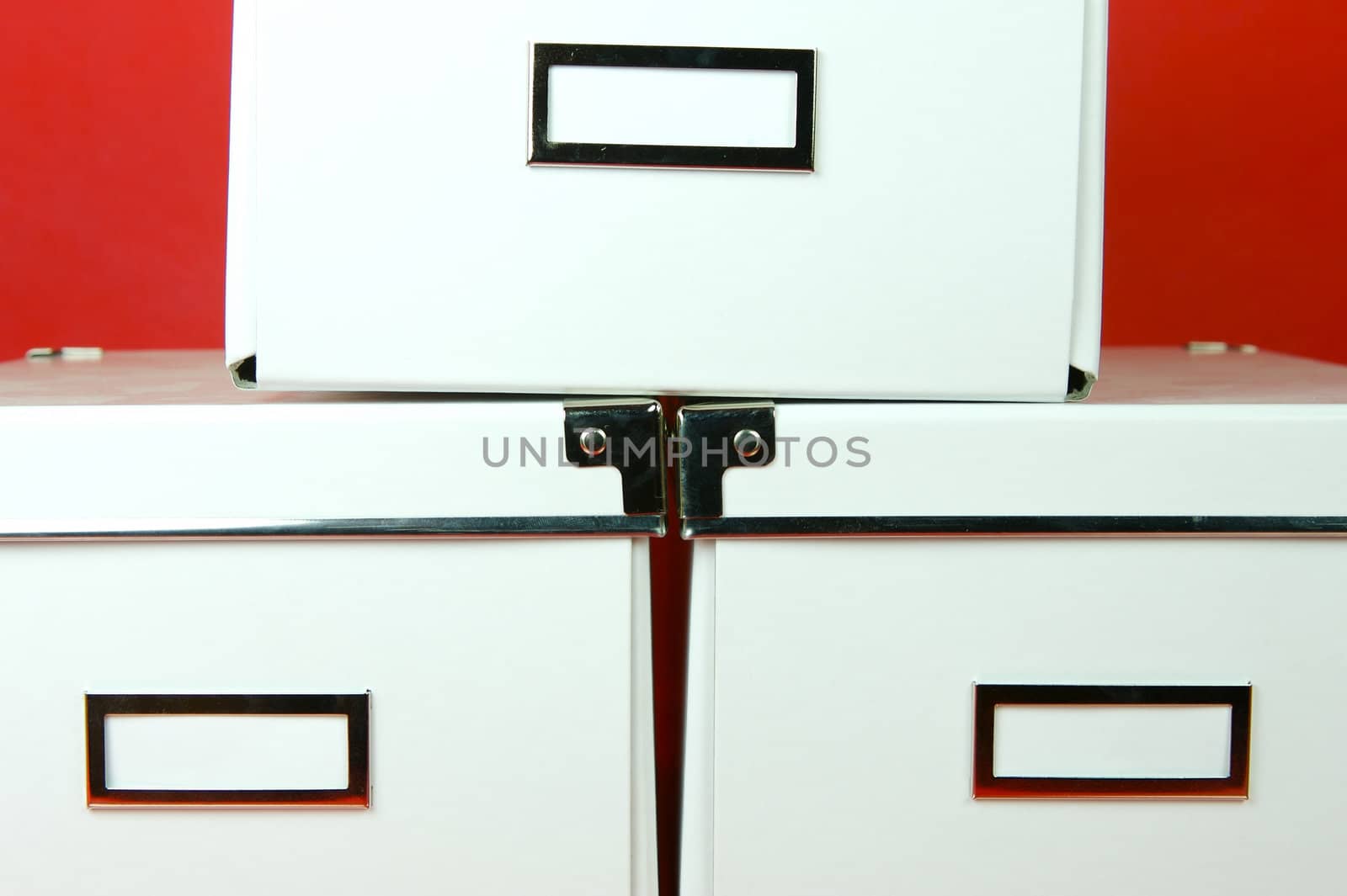 Storage boxes isolated against a red background