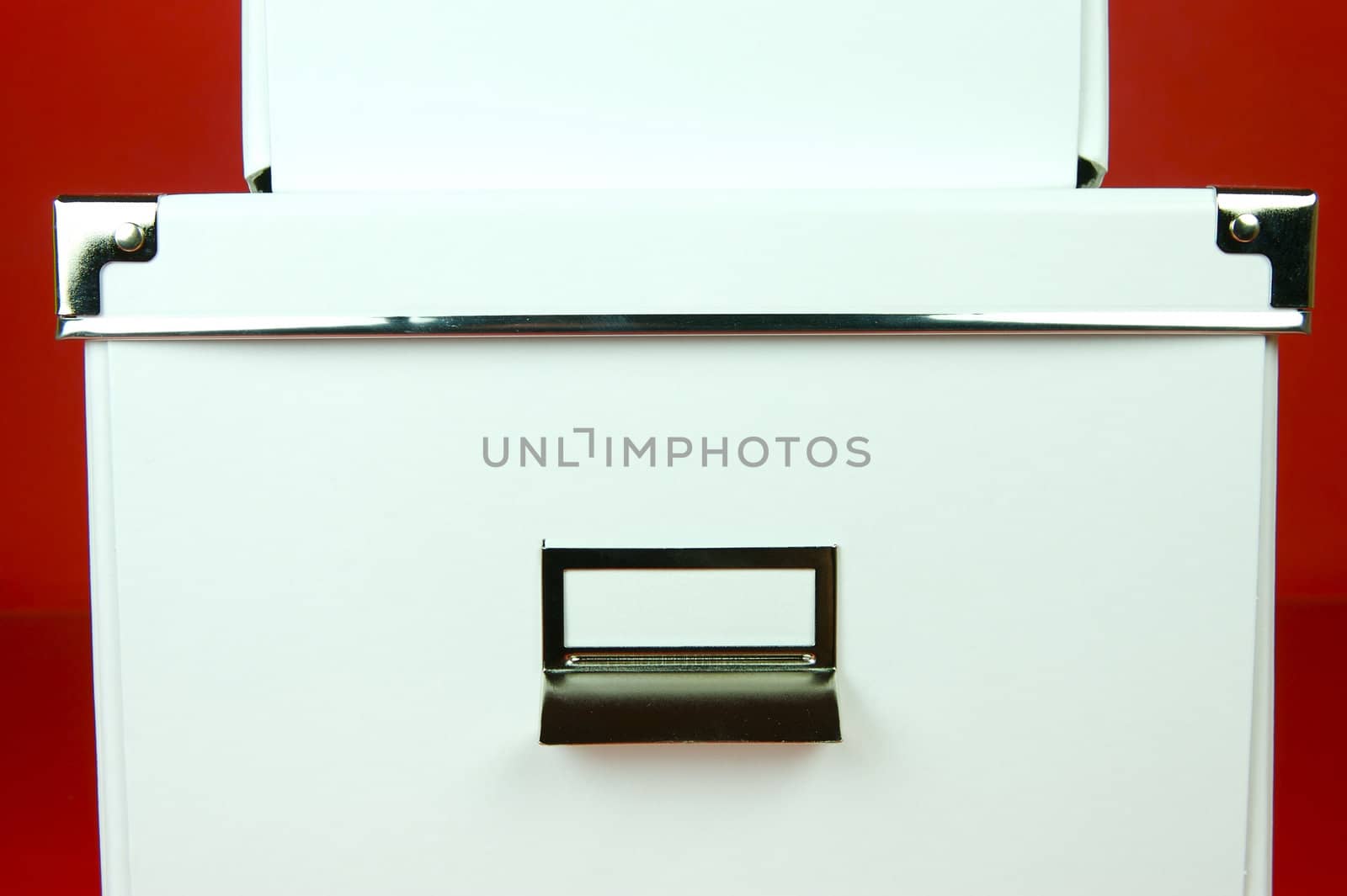 Storage boxes isolated against a red background