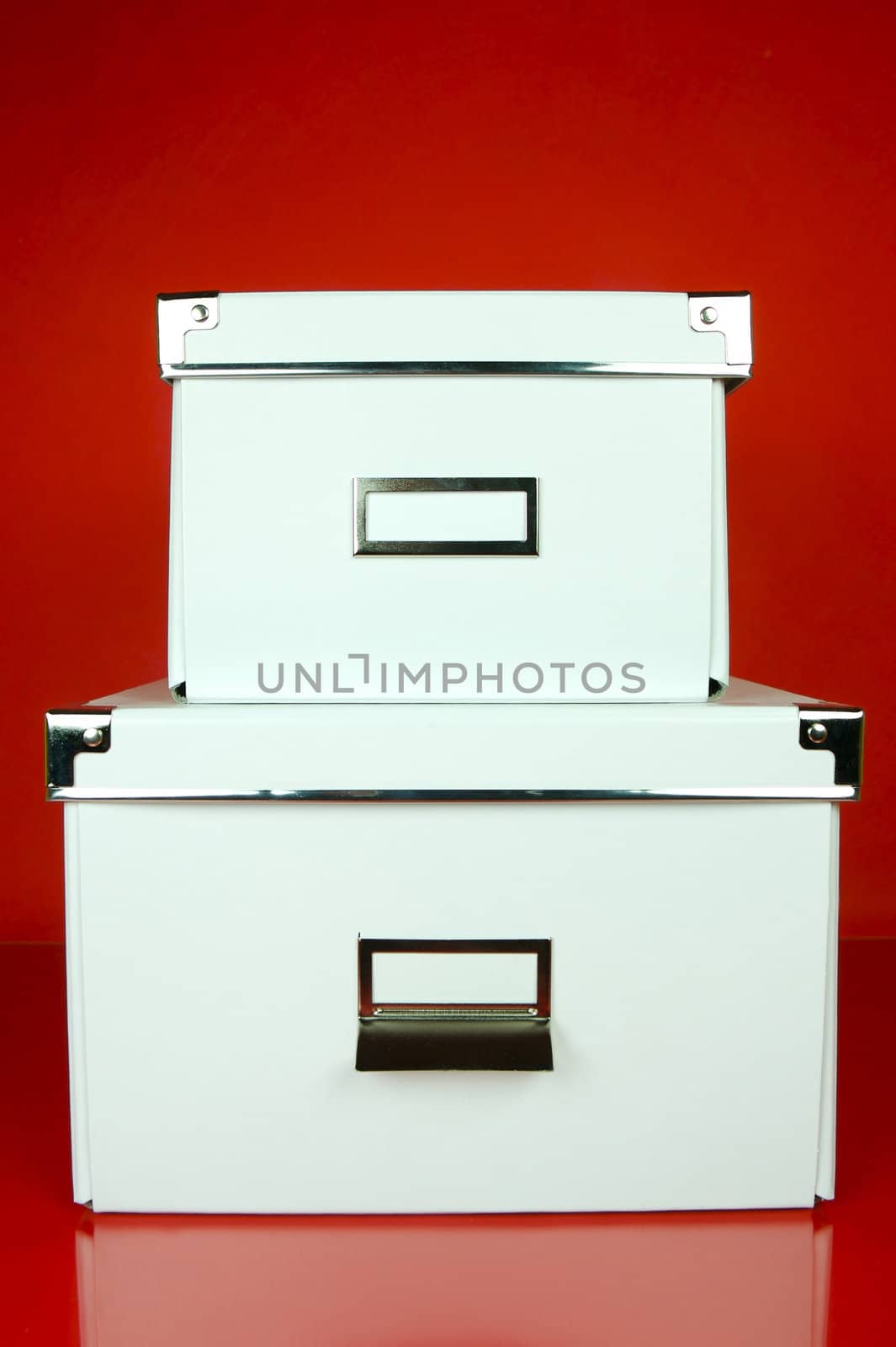 Storage boxes isolated against a red background