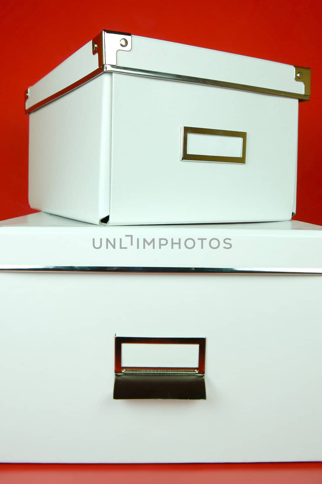 Storage boxes isolated against a red background