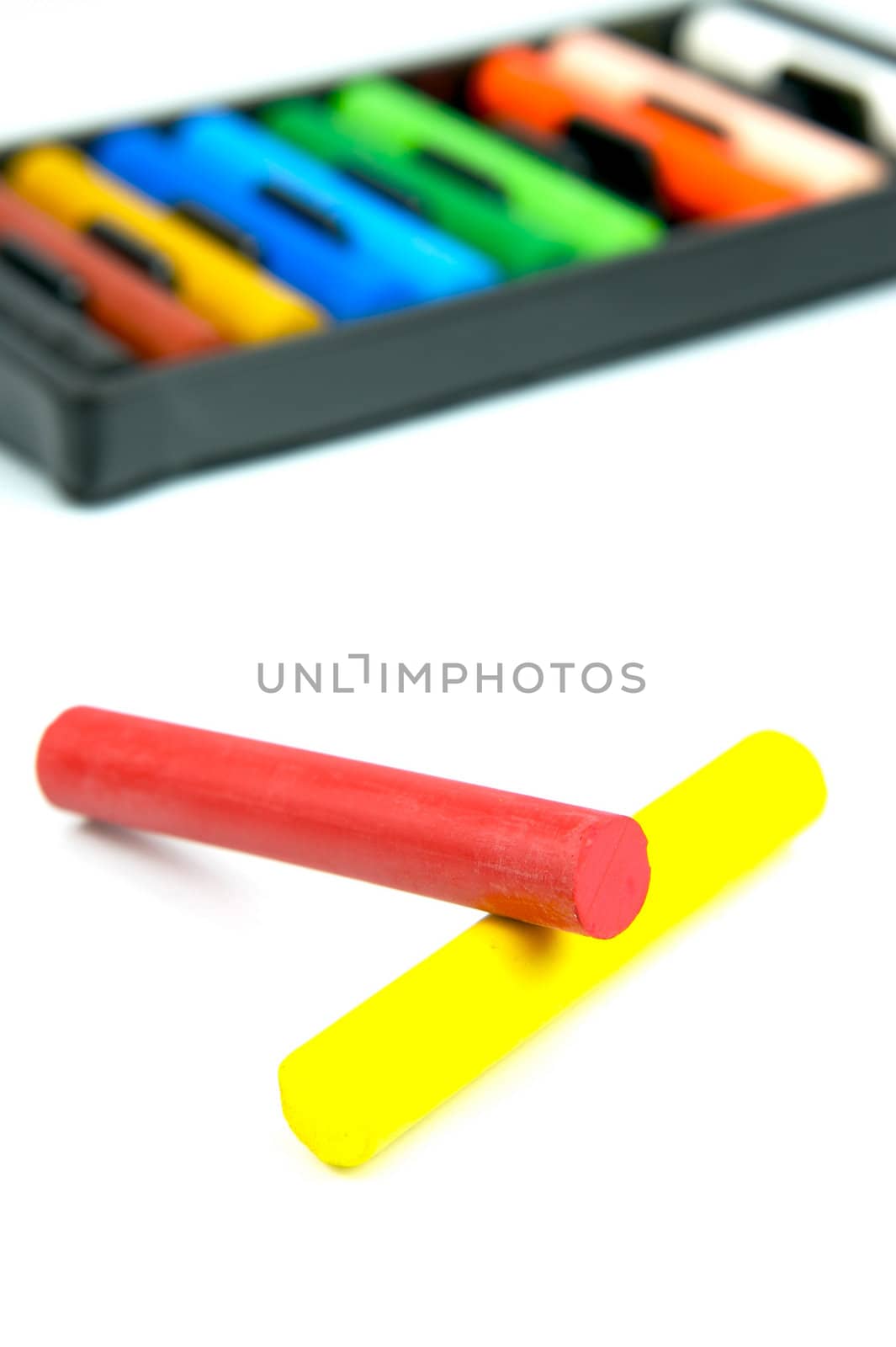 Oil pastels/crayons isolated against a white background