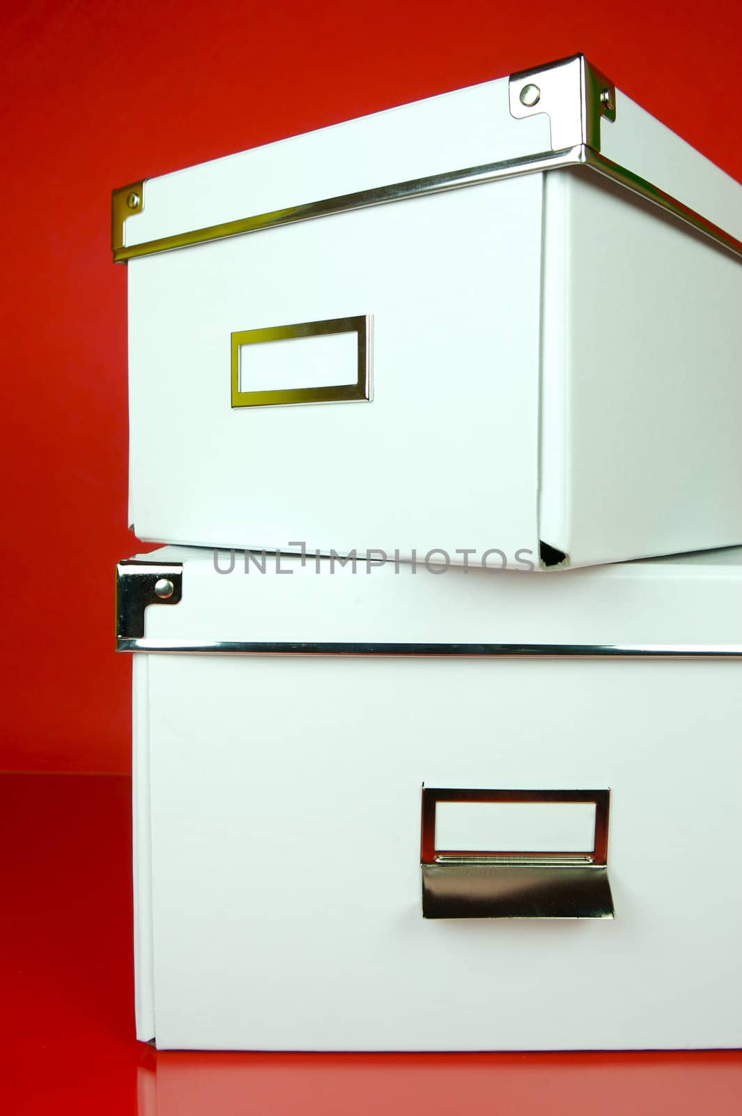 Storage boxes isolated against a red background