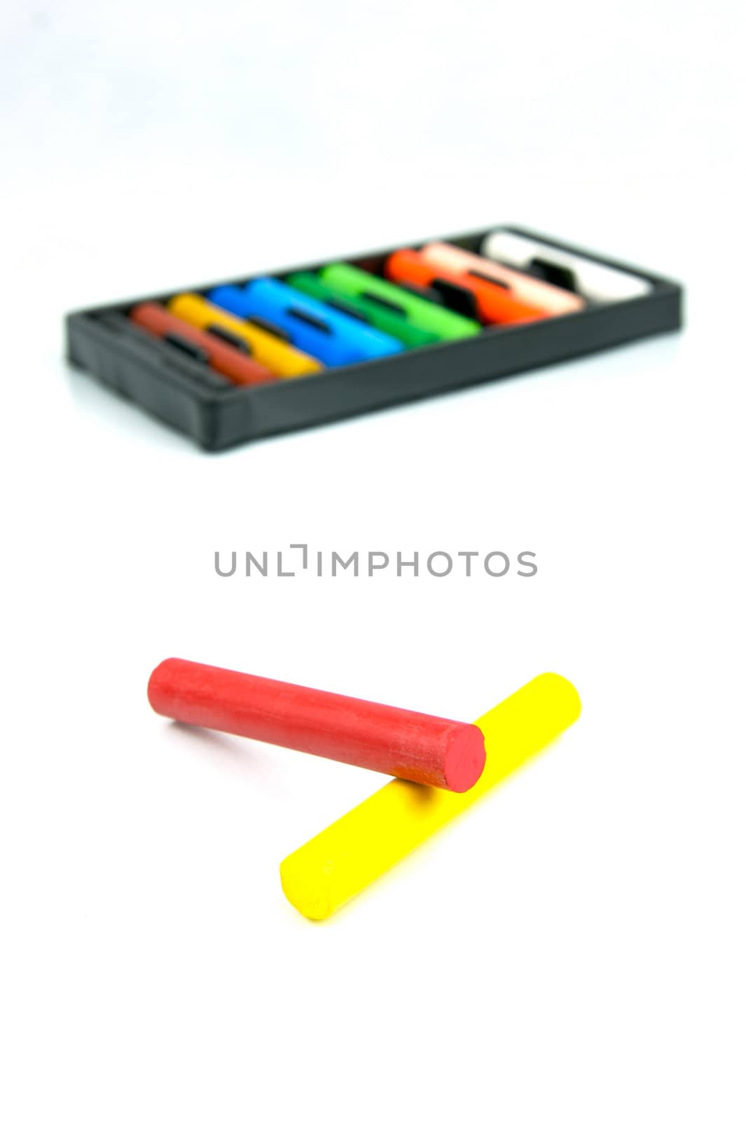 Oil pastels/crayons isolated against a white background