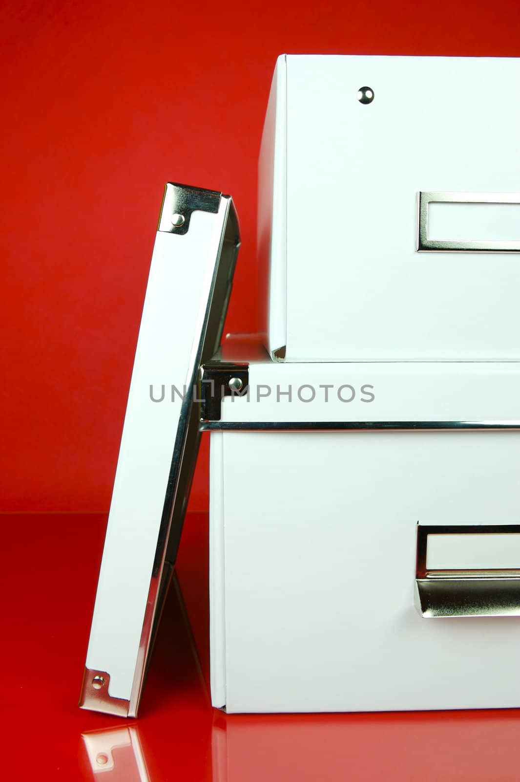 Storage boxes isolated against a red background