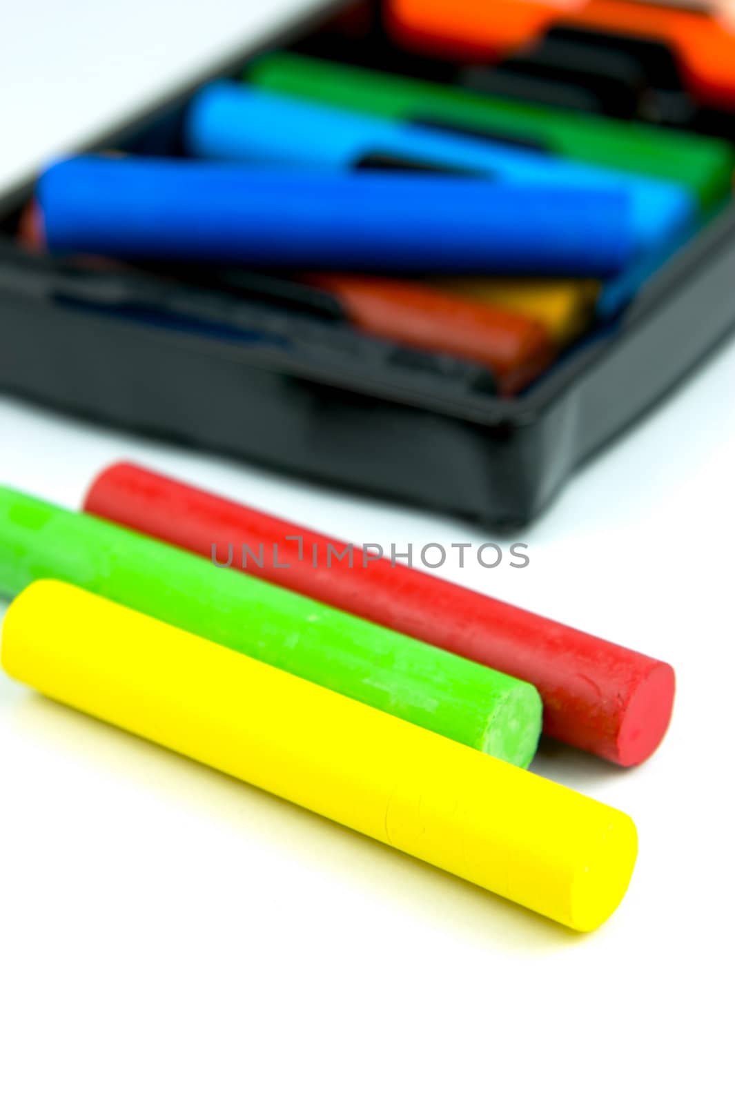 Oil pastels/crayons isolated against a white background