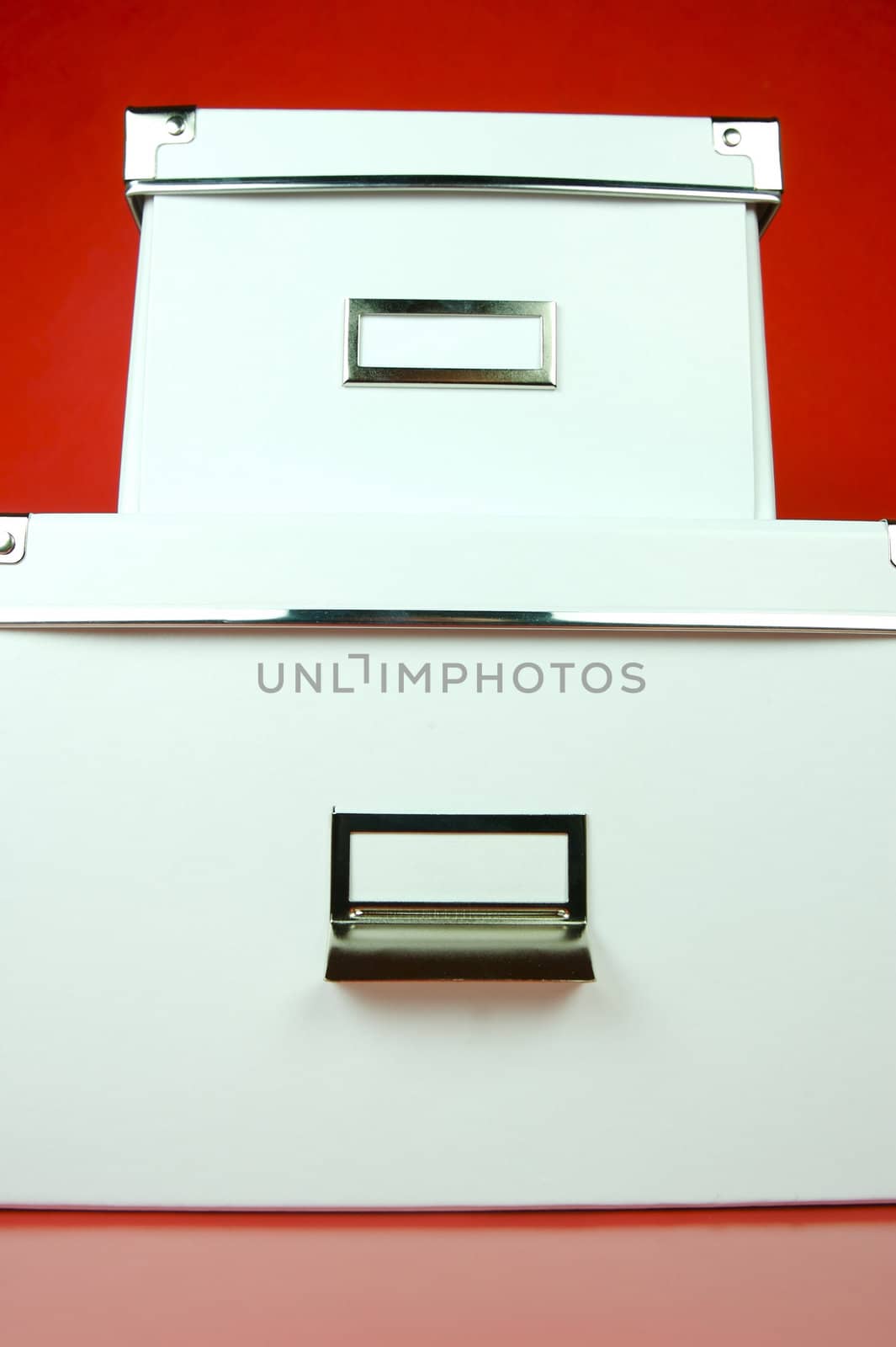 Storage boxes isolated against a red background