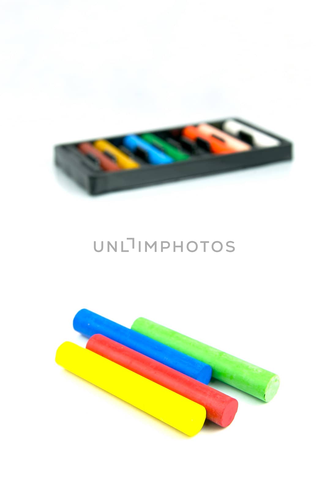 Oil pastels/crayons isolated against a white background