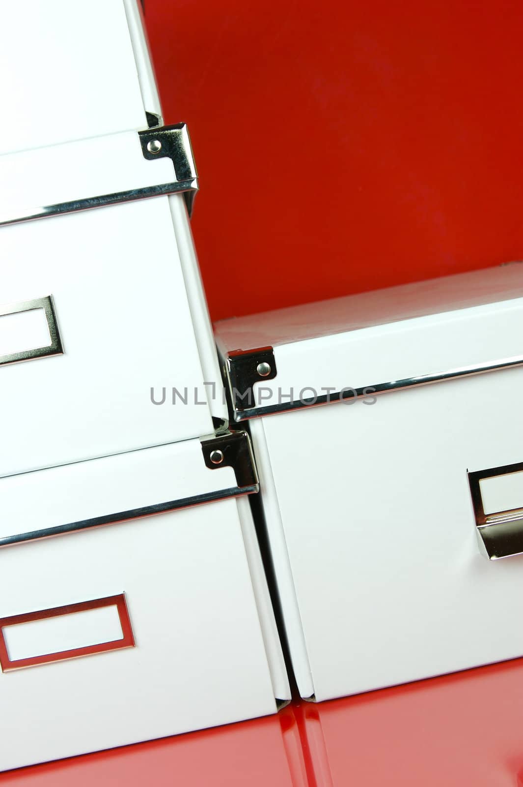 Storage boxes isolated against a red background