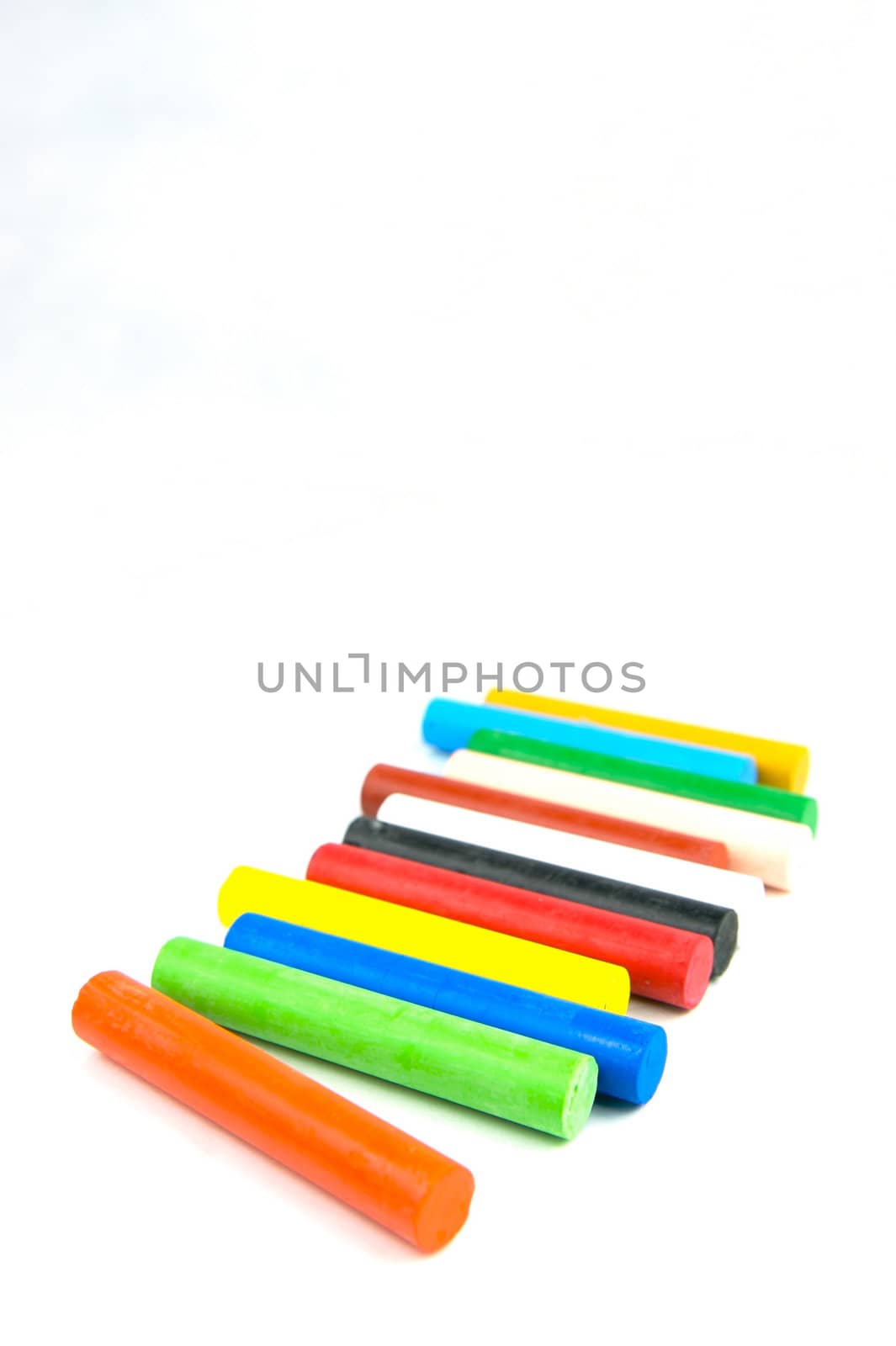 Oil pastels/crayons isolated against a white background