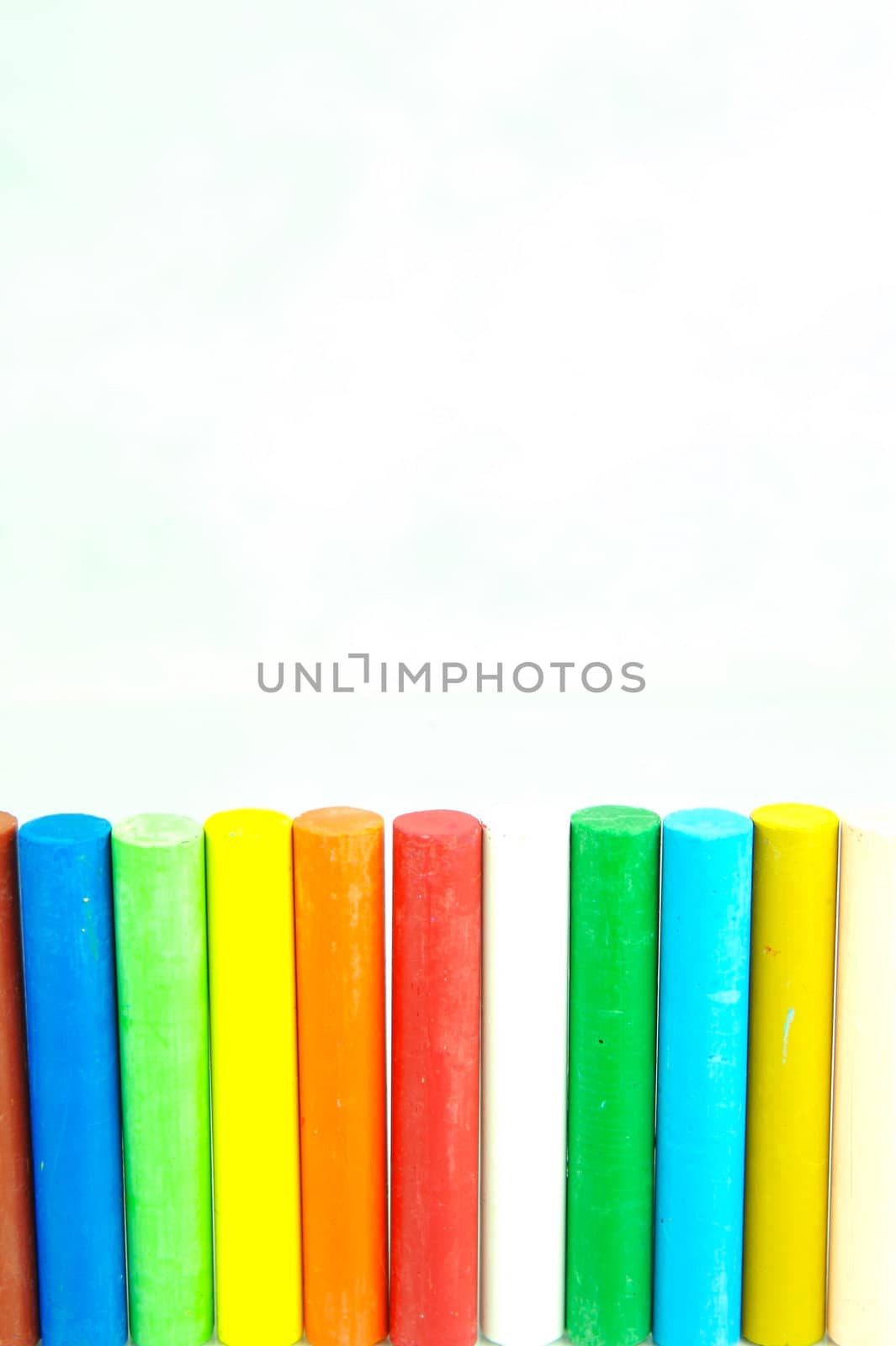 Oil pastels/crayons isolated against a white background