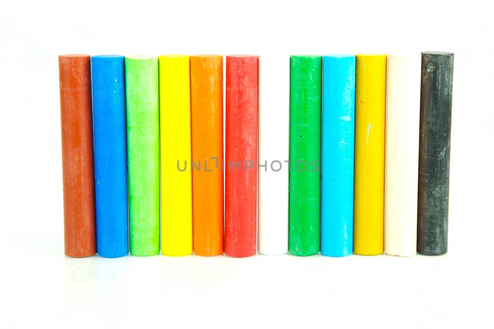 Oil pastels/crayons isolated against a white background