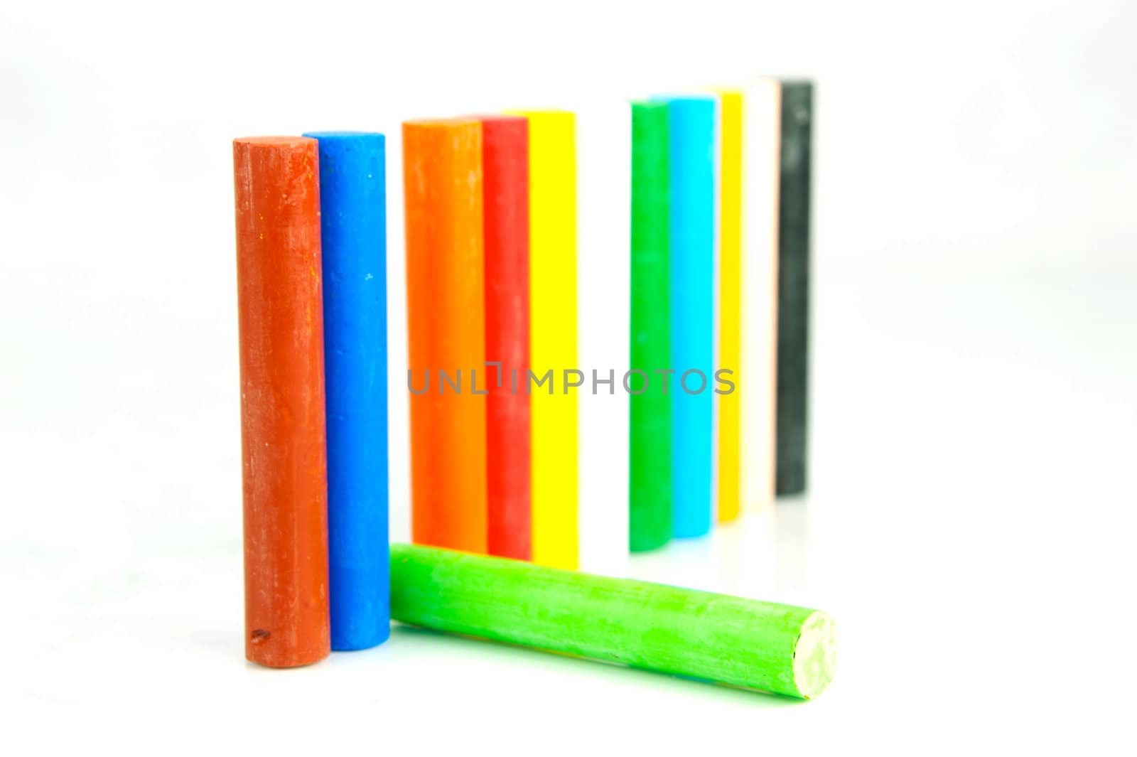 Oil pastels/crayons isolated against a white background