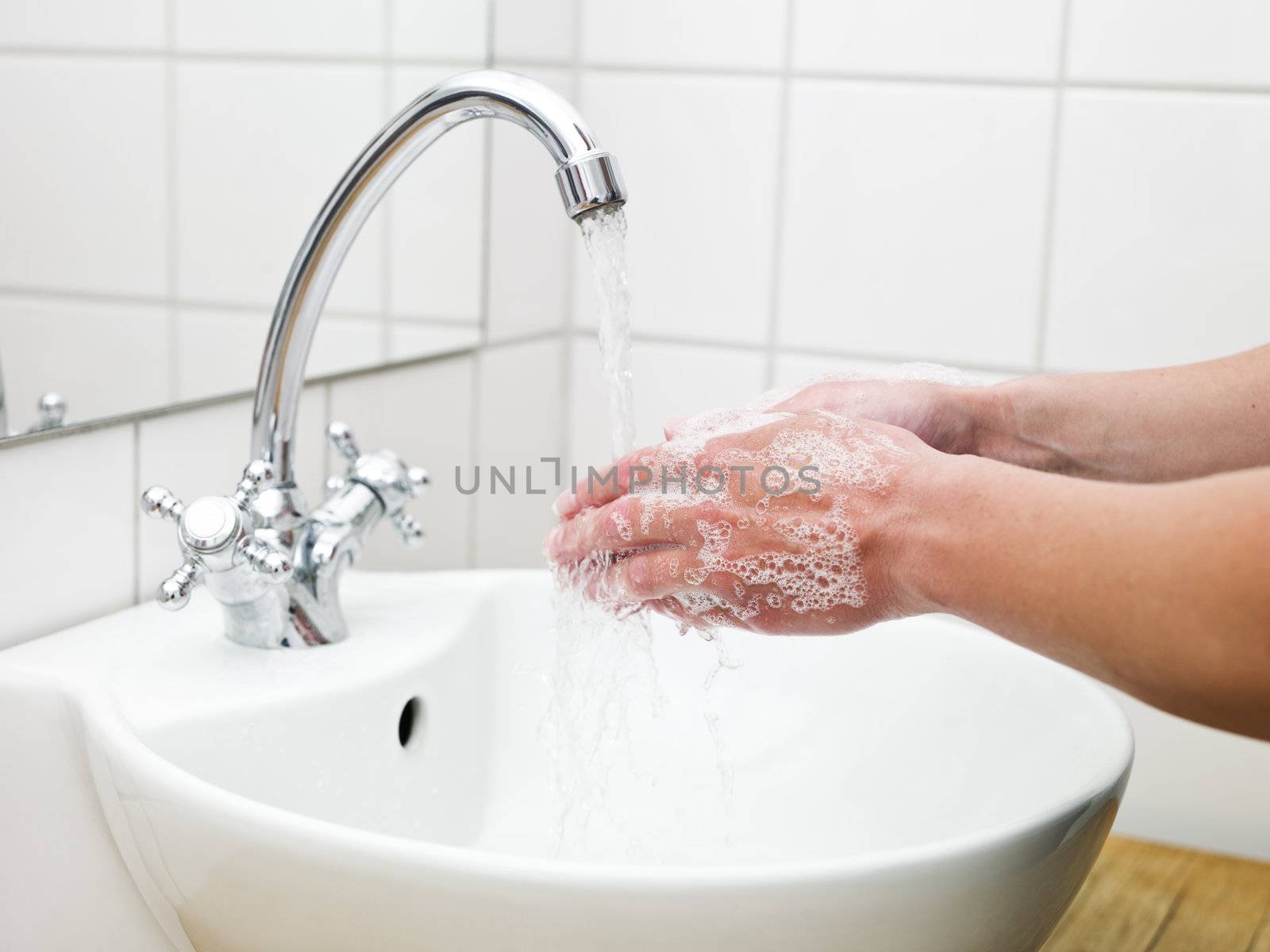 Washing hands at the bathroom
