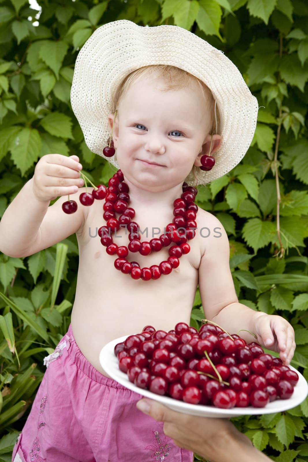 girl with red cherry beads and earrings by vsurkov