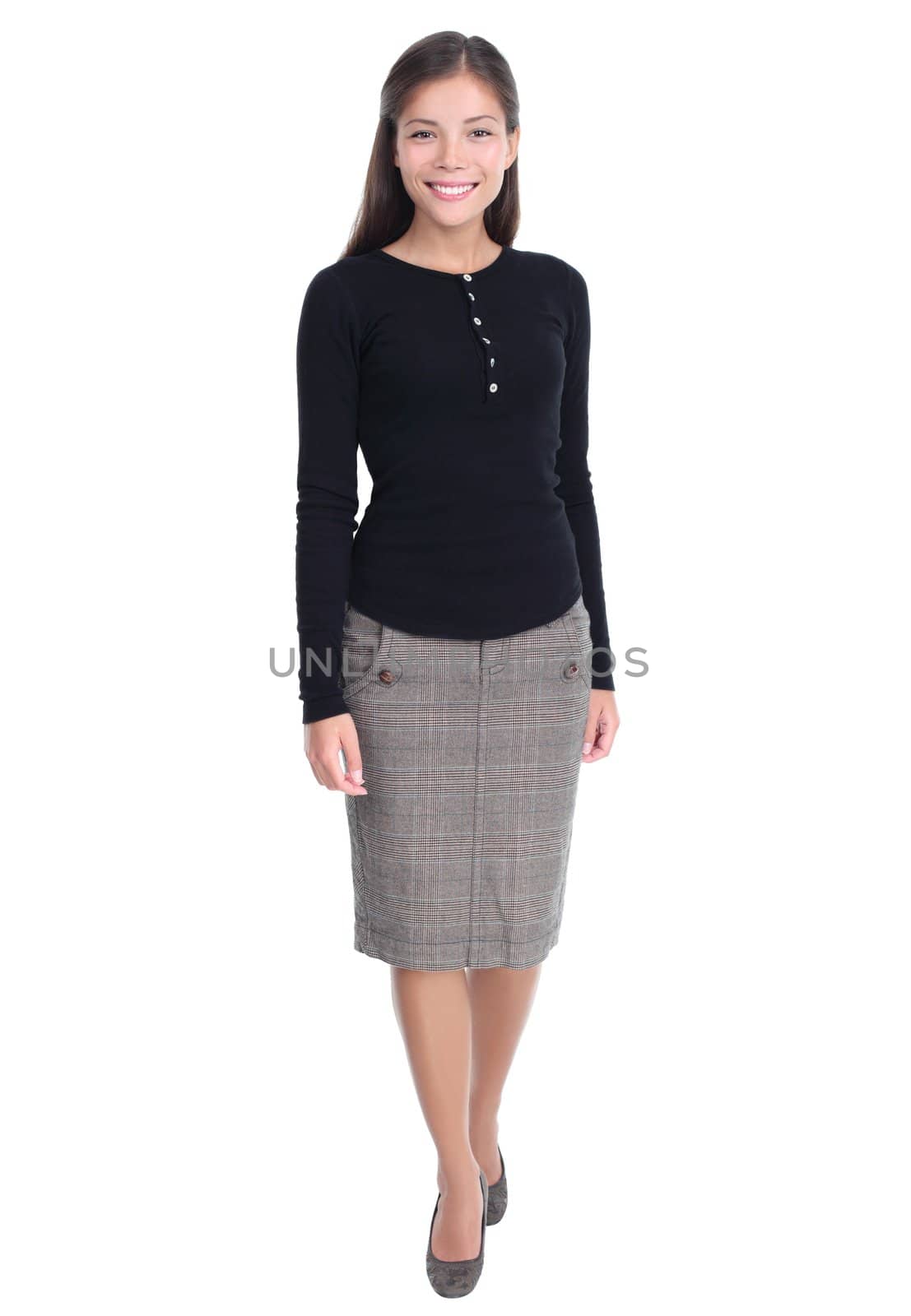 Businesswoman isolated walking towards the camera in full length Casual beautiful young mixed race chinese / caucasian business woman isolated on white background.