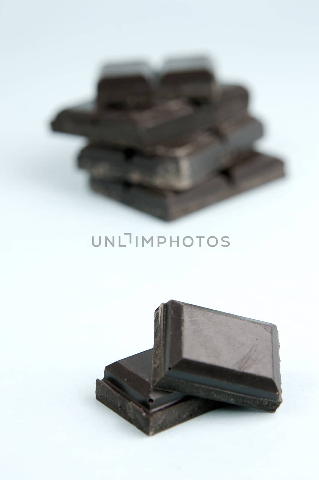 Dark Chocolate isolated against a blue background