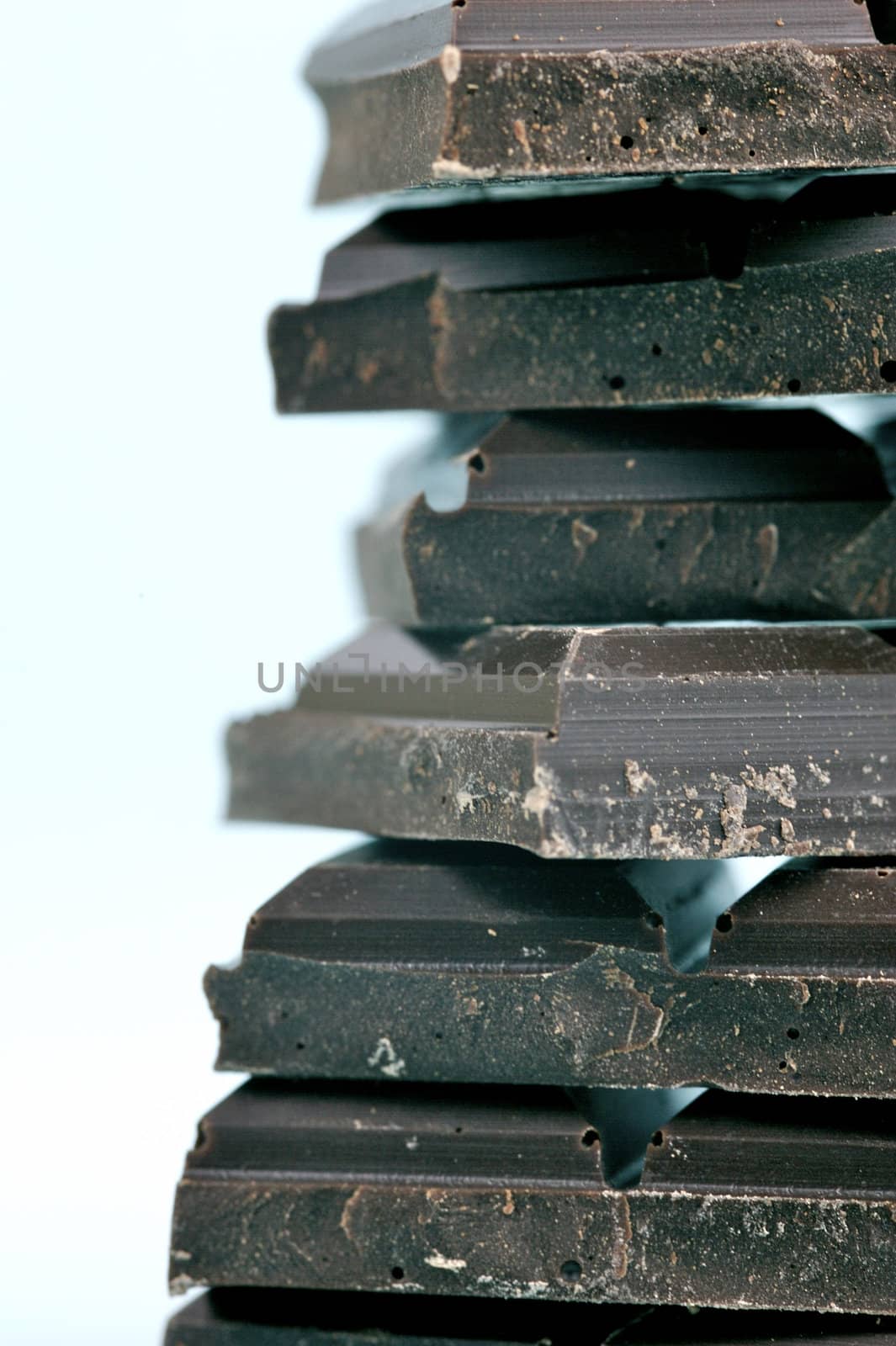 Dark Chocolate isolated against a blue background