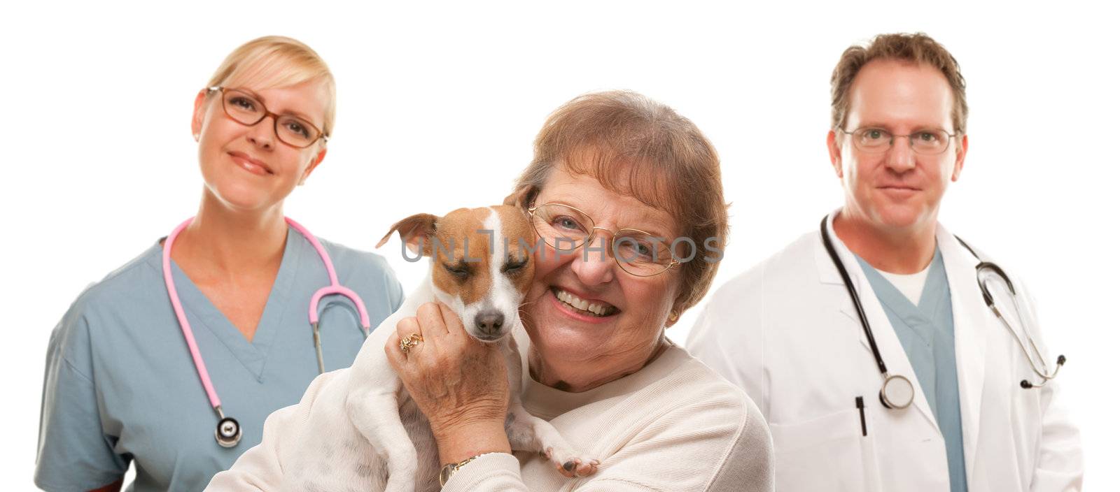 Happy Senior Woman with Dog and Veterinarian Team by Feverpitched