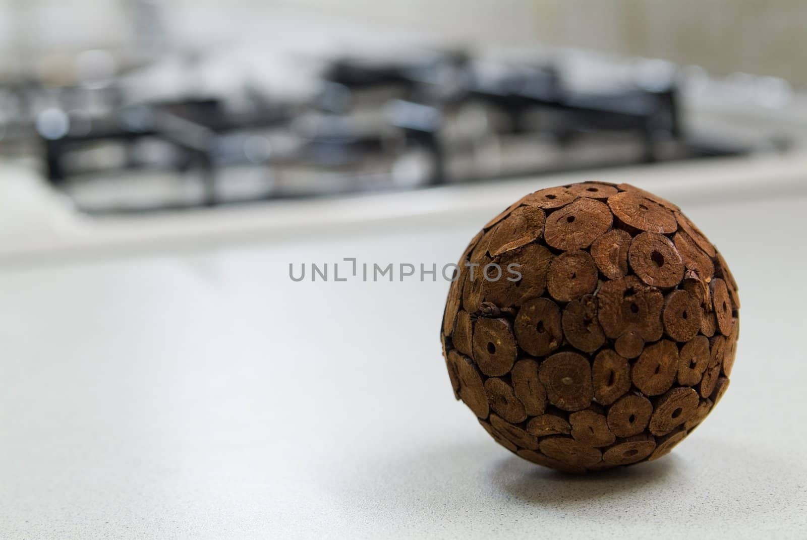 Straw sphere on the kitchen table near gas stove