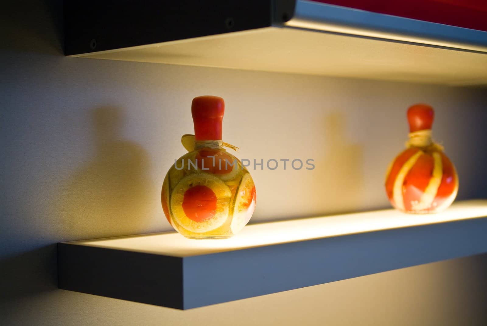 Two decorative bottles on light table on kitchen by palomnik