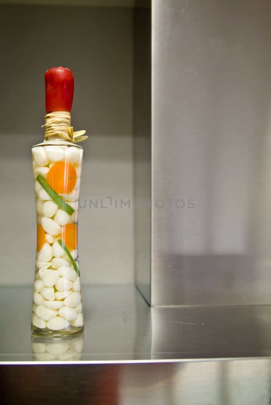 Decorative bottle on the stainless surface by palomnik