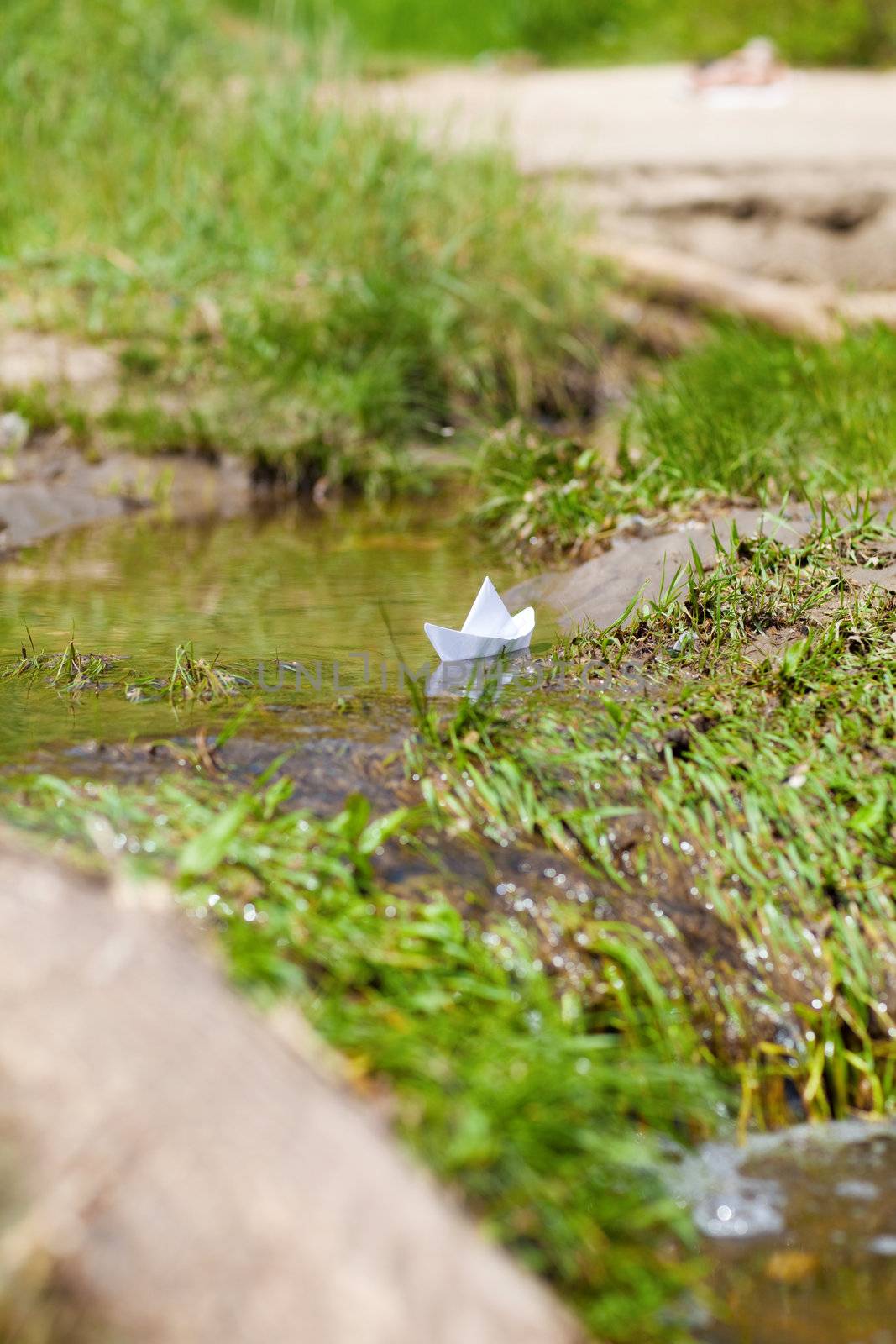 A Toy Boat in a Stream