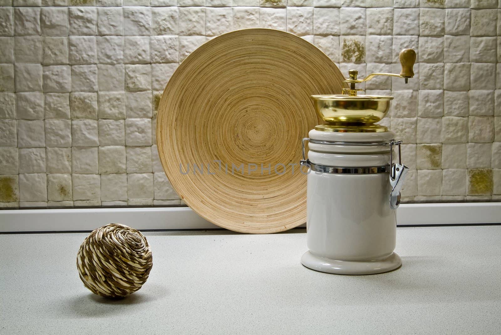 Coffee grinder with wooden plate and decorative straws sphere