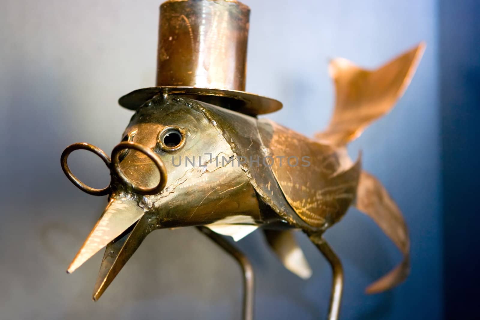 Iron bird in top hat and glasses standing
