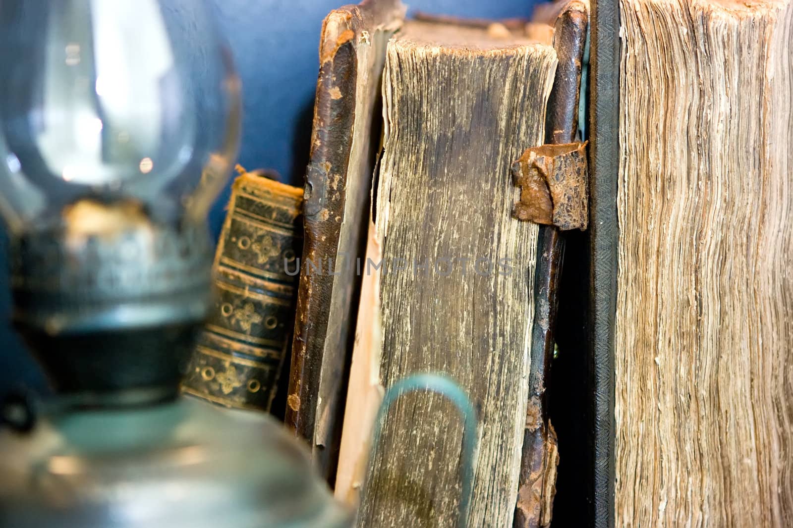 Old books and kerosene lamp
