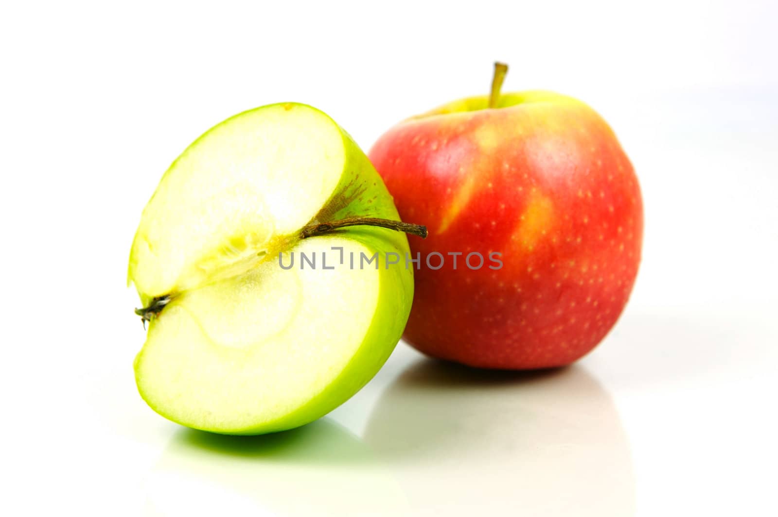 Red and green apples isolated against a white background