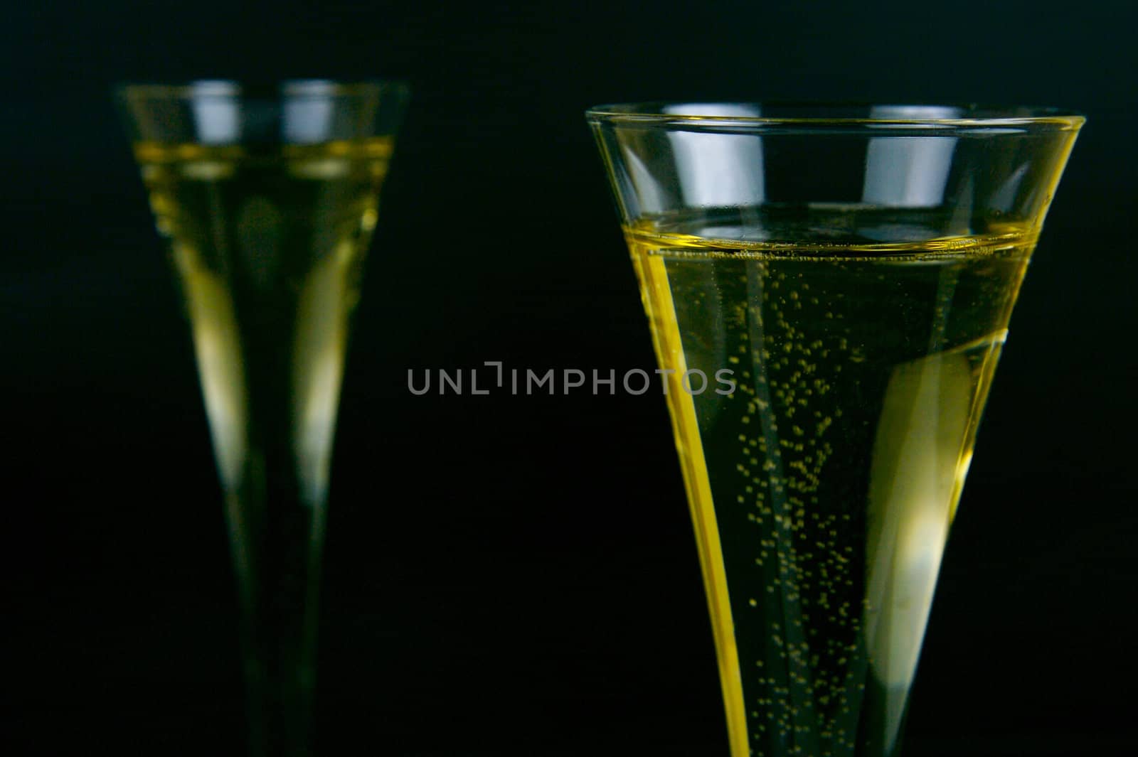 Sparkling wine isolated against a black background