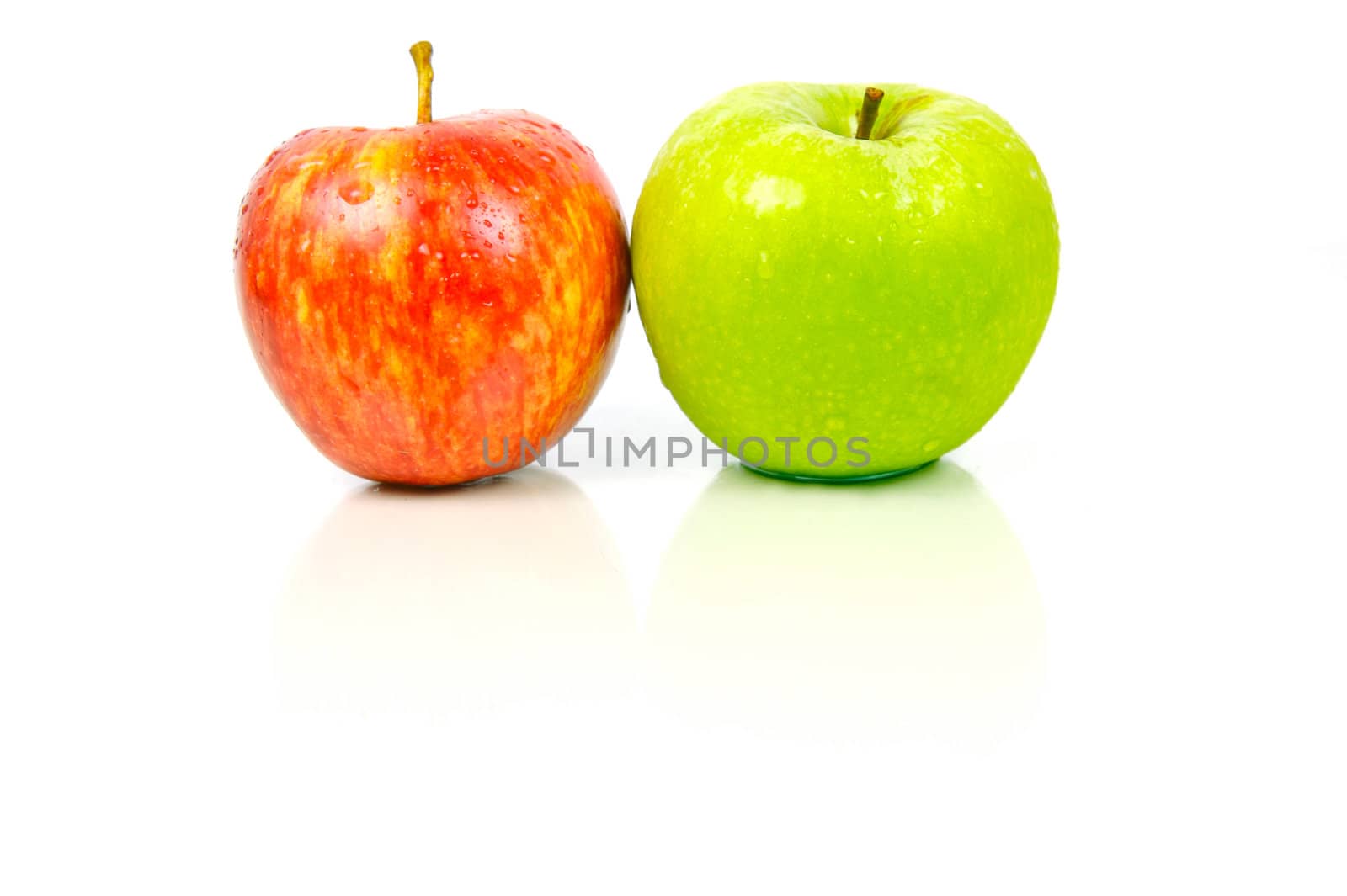 Red and green apples isolated against a white background