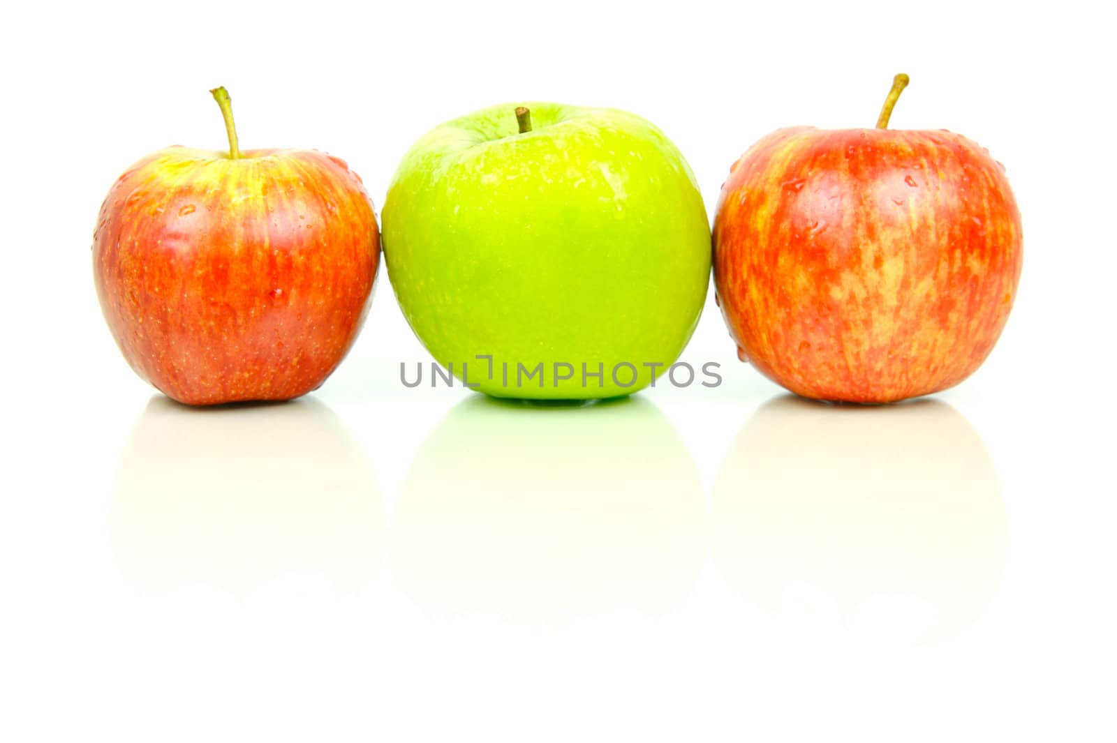 Red and green apples isolated against a white background