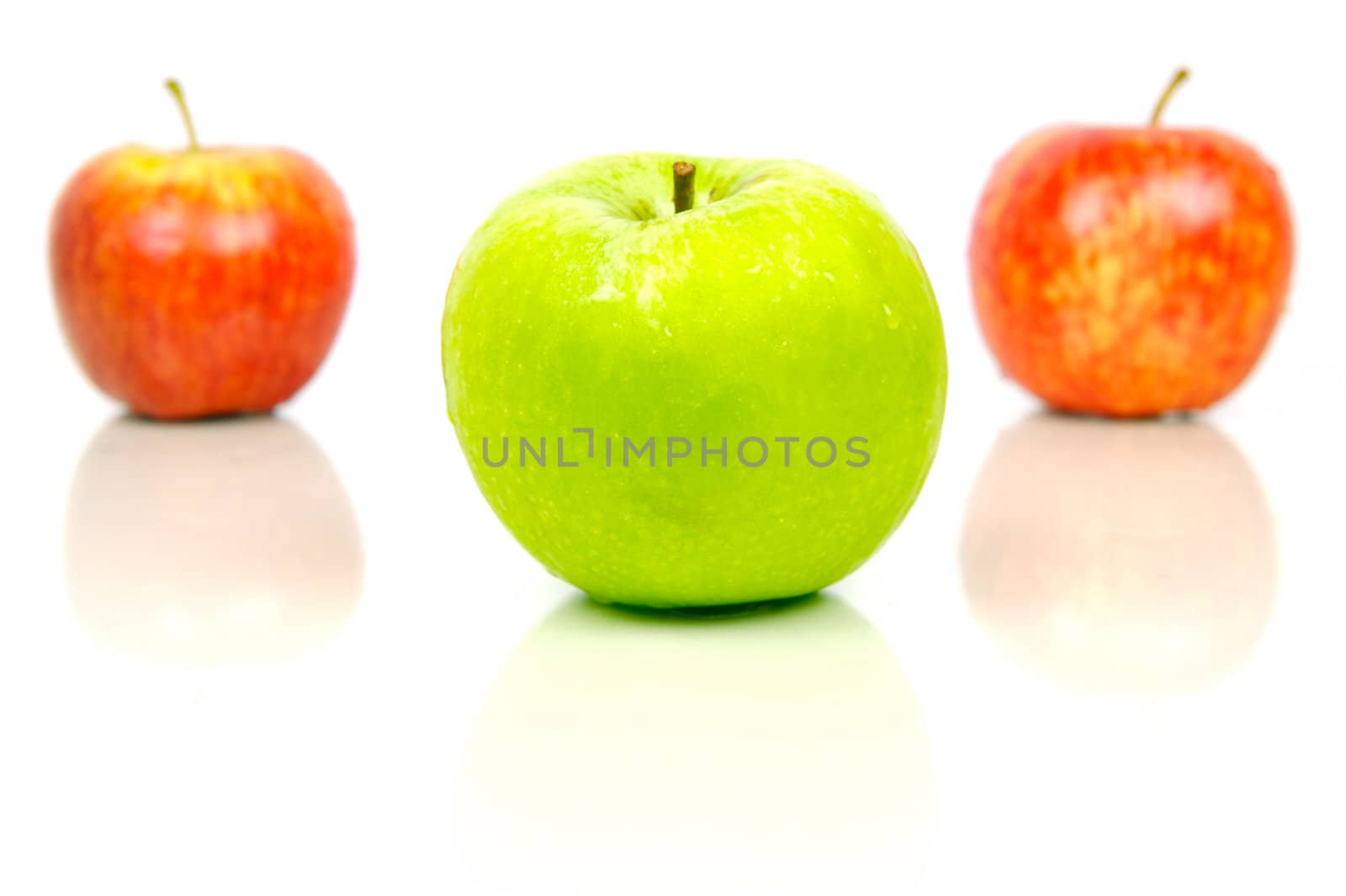 Red and green apples isolated against a white background