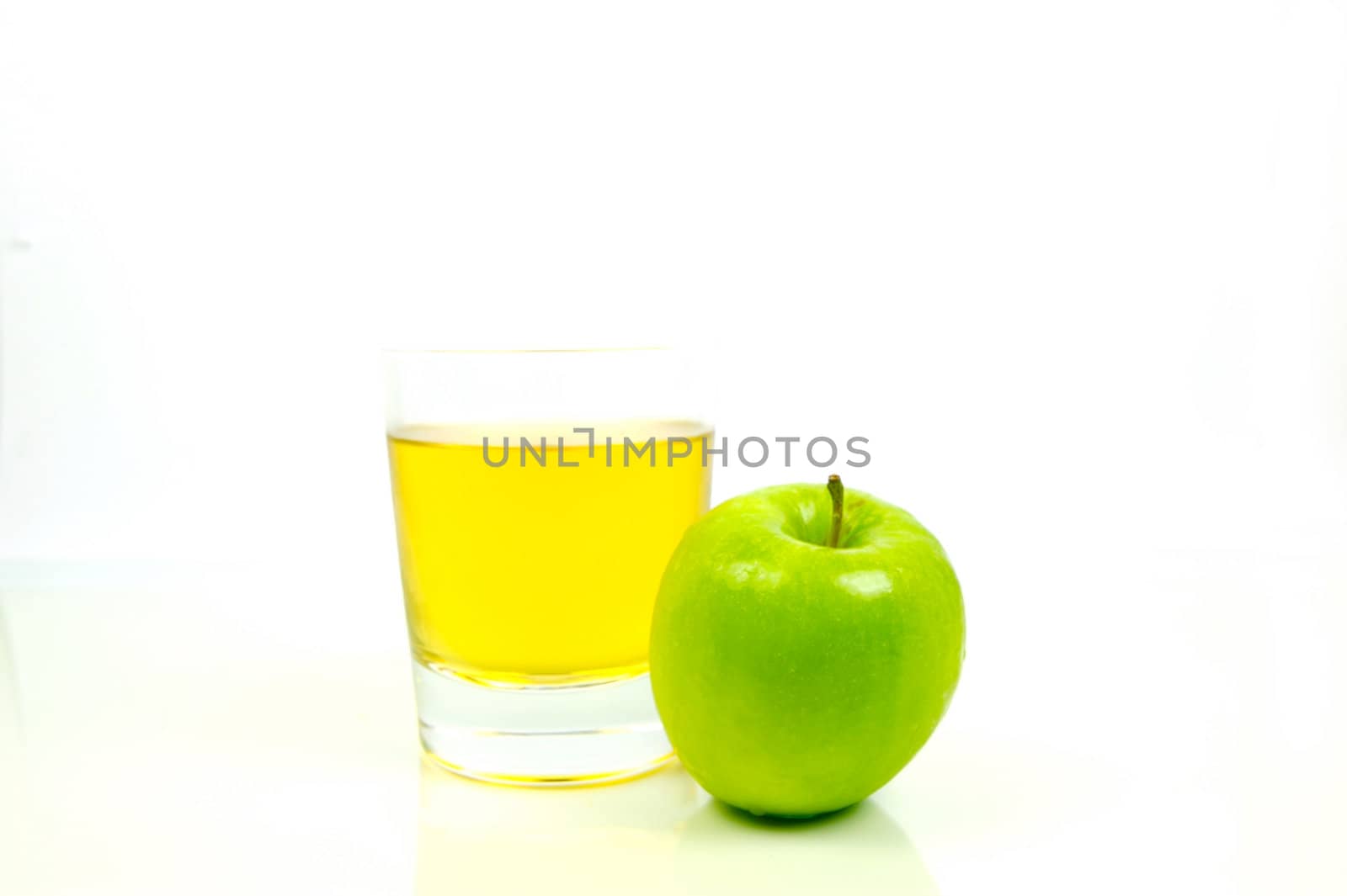 Apple juice isolated against a white background