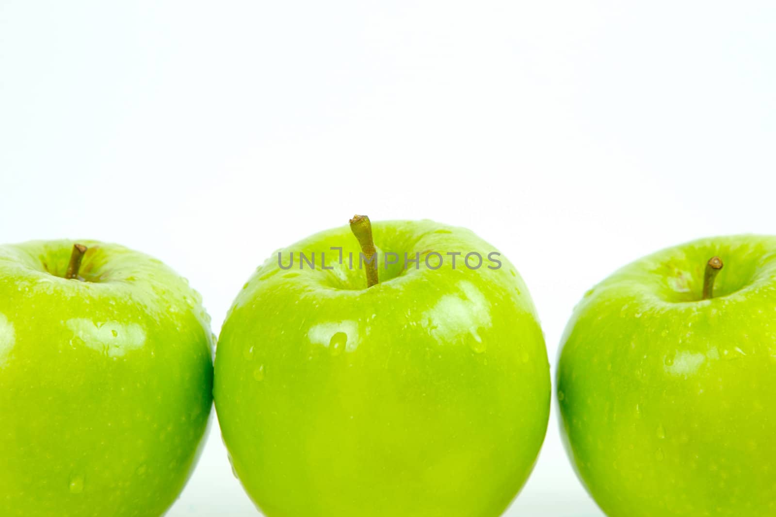 Green apples isolated against a white background