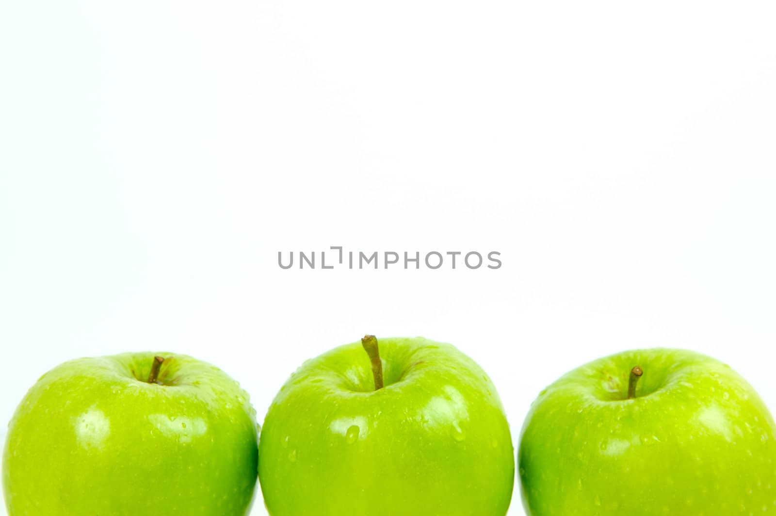 Green apples isolated against a white background