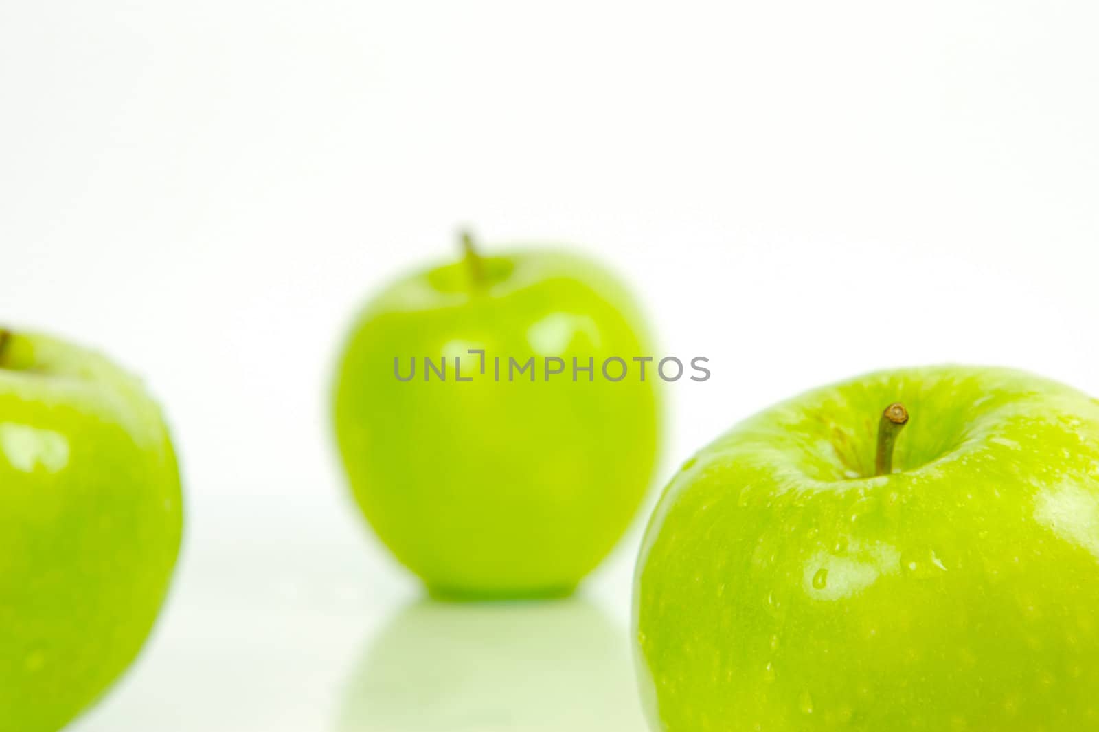 Green apples isolated against a white background