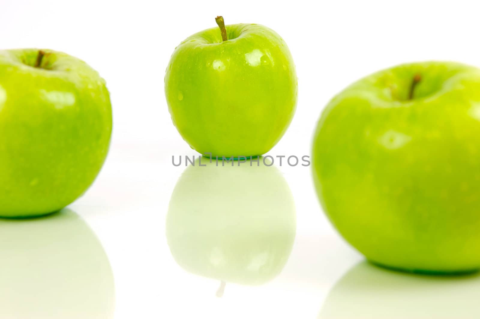 Green apples isolated against a white background