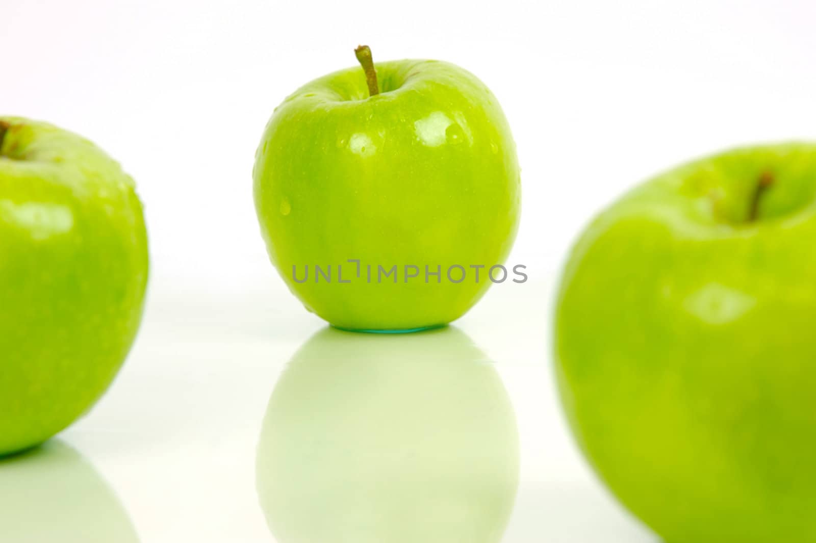 Green apples isolated against a white background