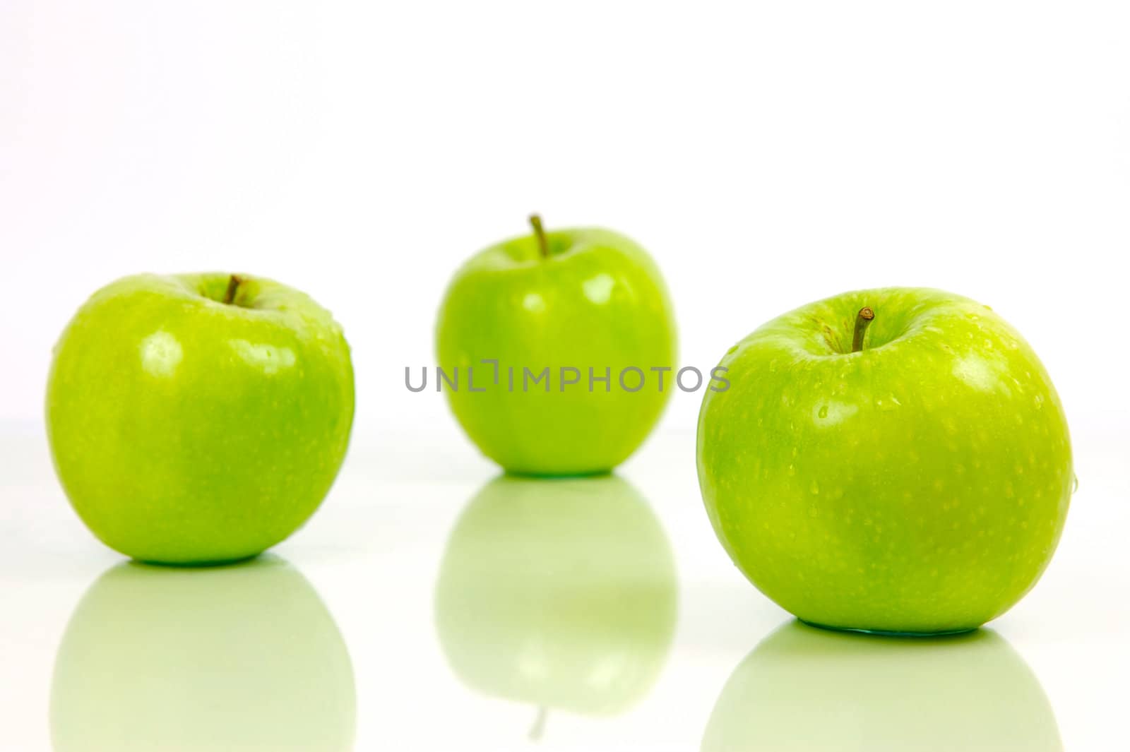 Green apples isolated against a white background